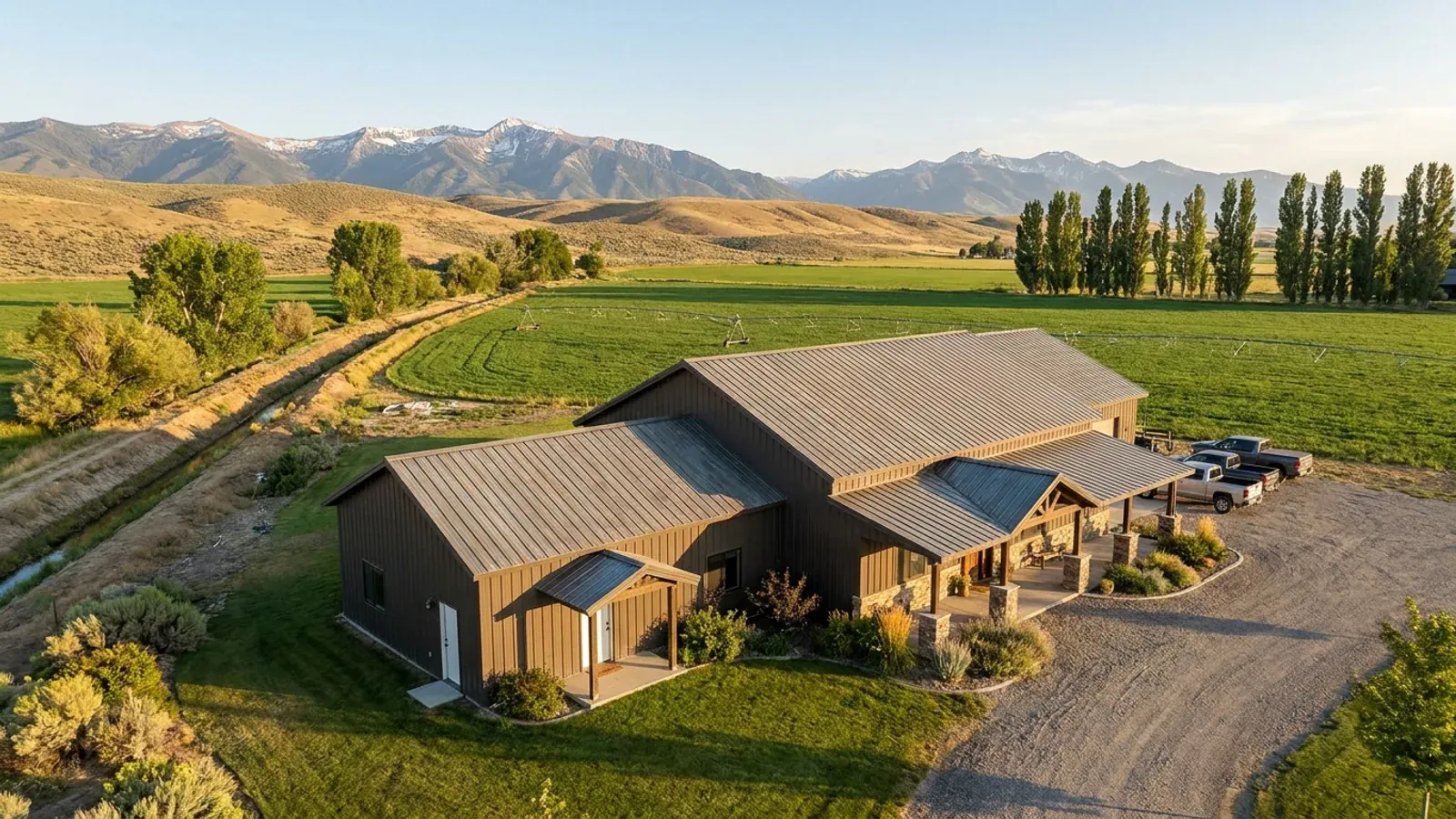 A barndominium with a smaller attached in-law suite wing that has its own separate covered entry, distinct from the main entry.